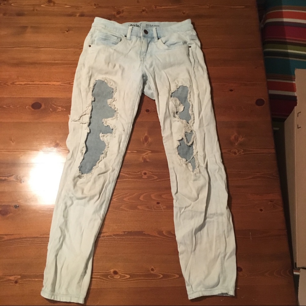 Light wash jeans with destructed patched design